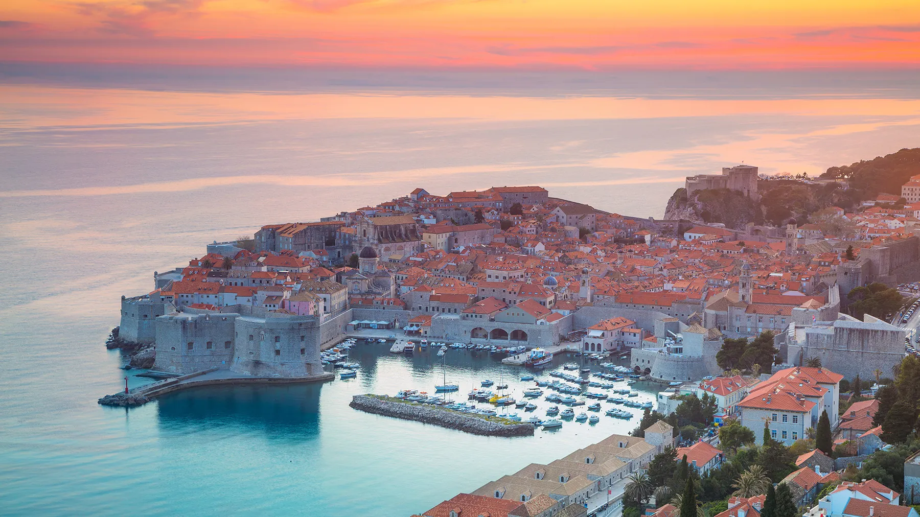 Dubrovnik rooftops at sunset, looking out over the Adriatic