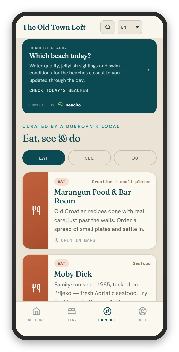 The Explore screen: nearby beach conditions and a curated Eat, See and Do list.